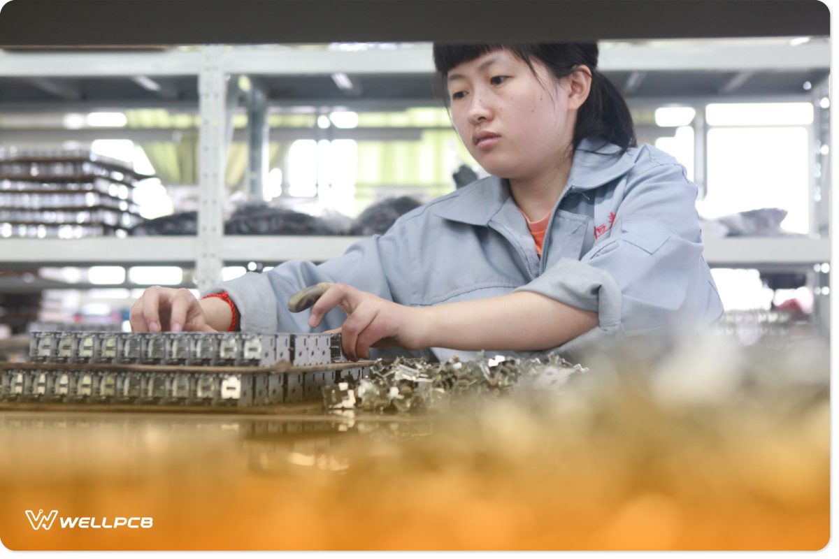 A Chinese engineer working on rigid-flex PCB assembly