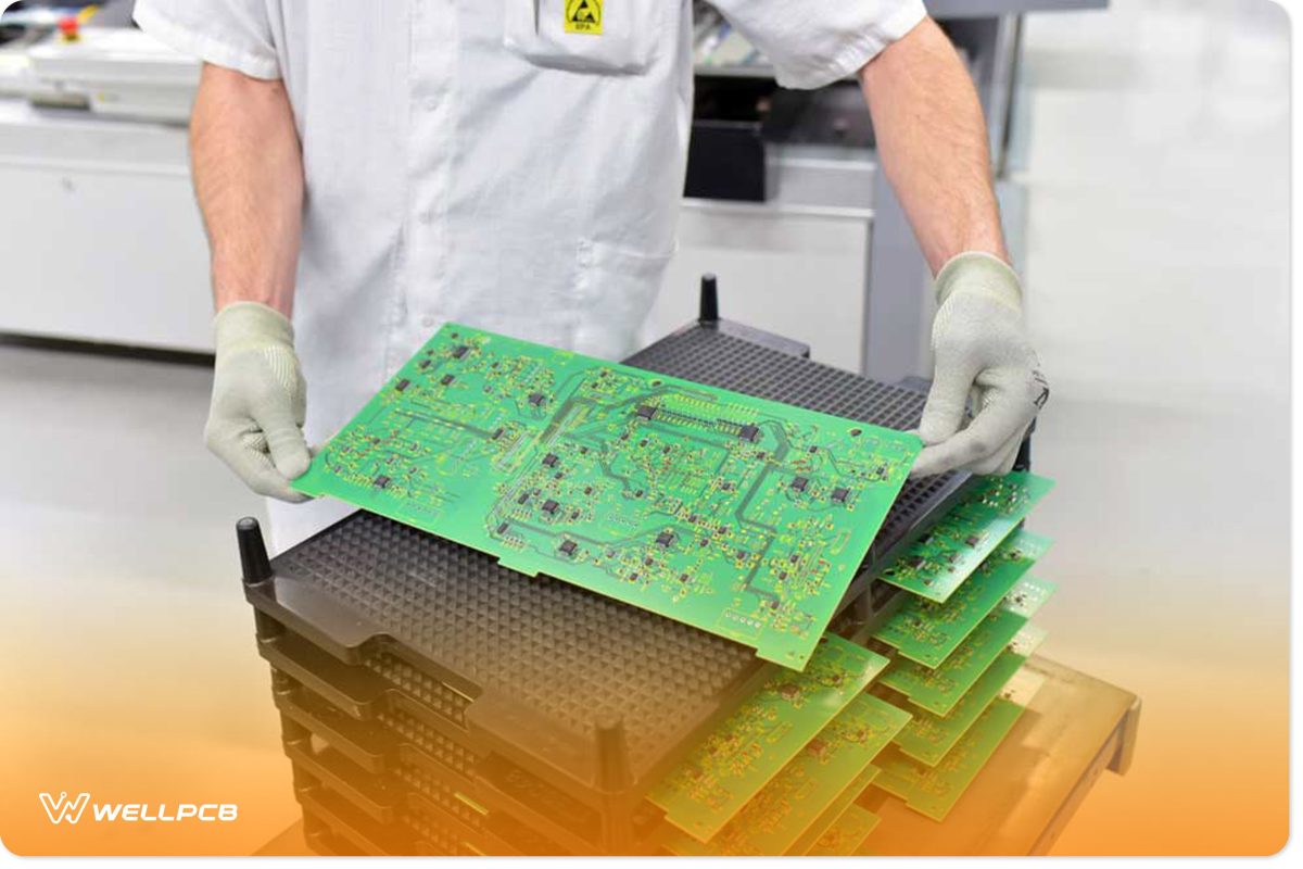 A Man Stacking Circuit Boards for Assembly