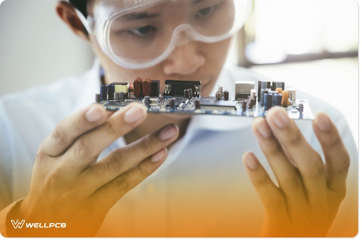 A Technician Checking an Electronic Circuit Board