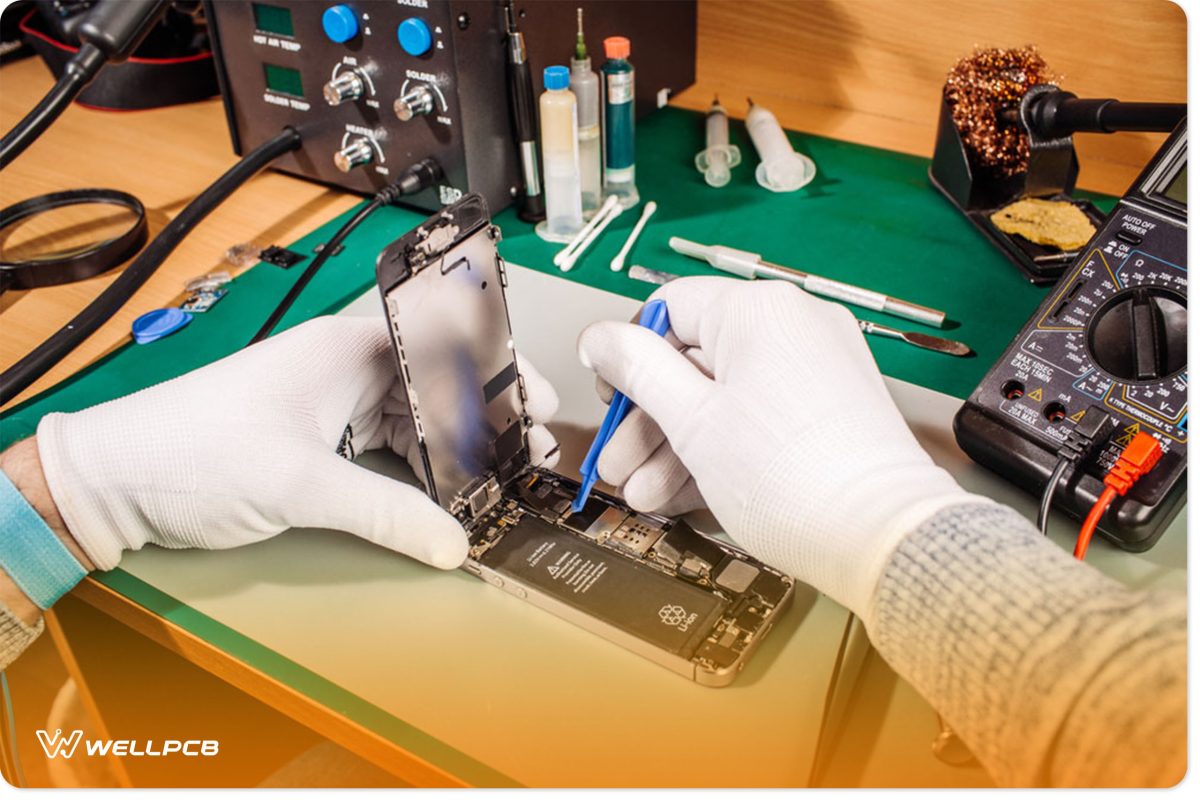 A technician removing LCD screens of phones