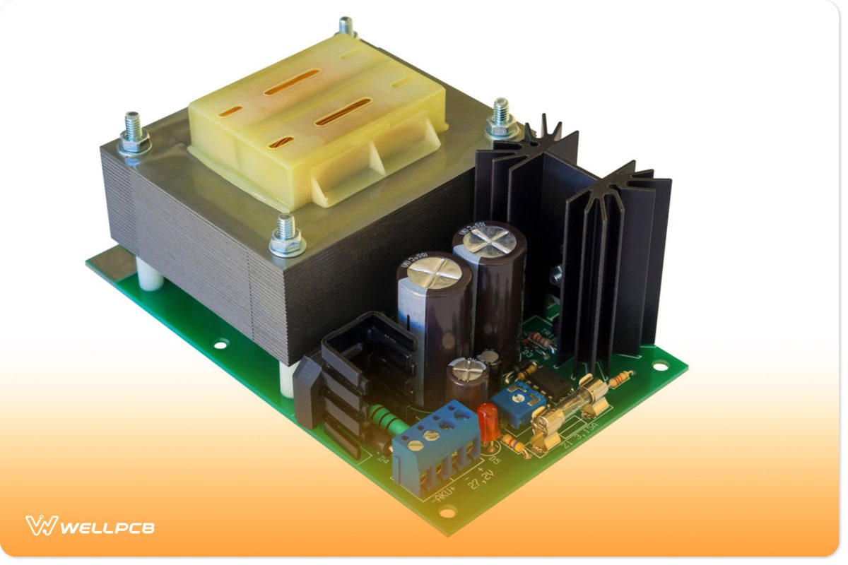 An AC-DC converter circuit board with a transformer and electronic components