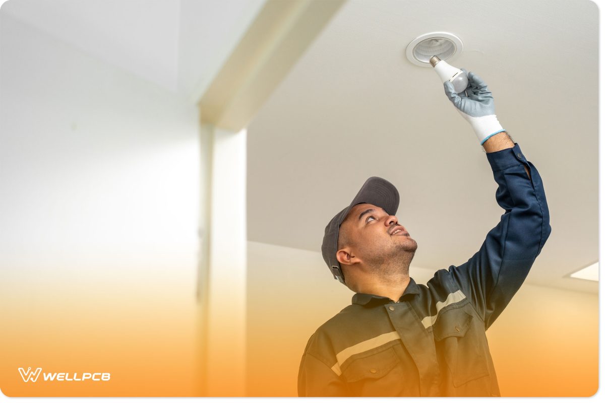 Image: Electrician installing led light bulbs 