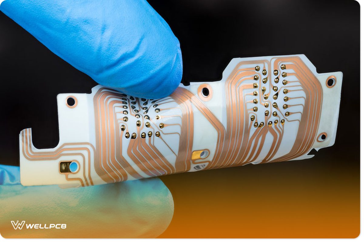 Flex printed circuit boards with a copper layer in man fingers isolated on black background.