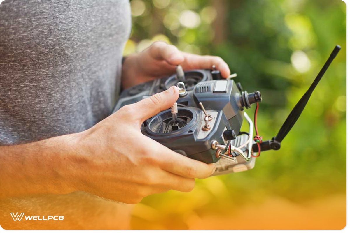 Man holding remote control car with a transmitter