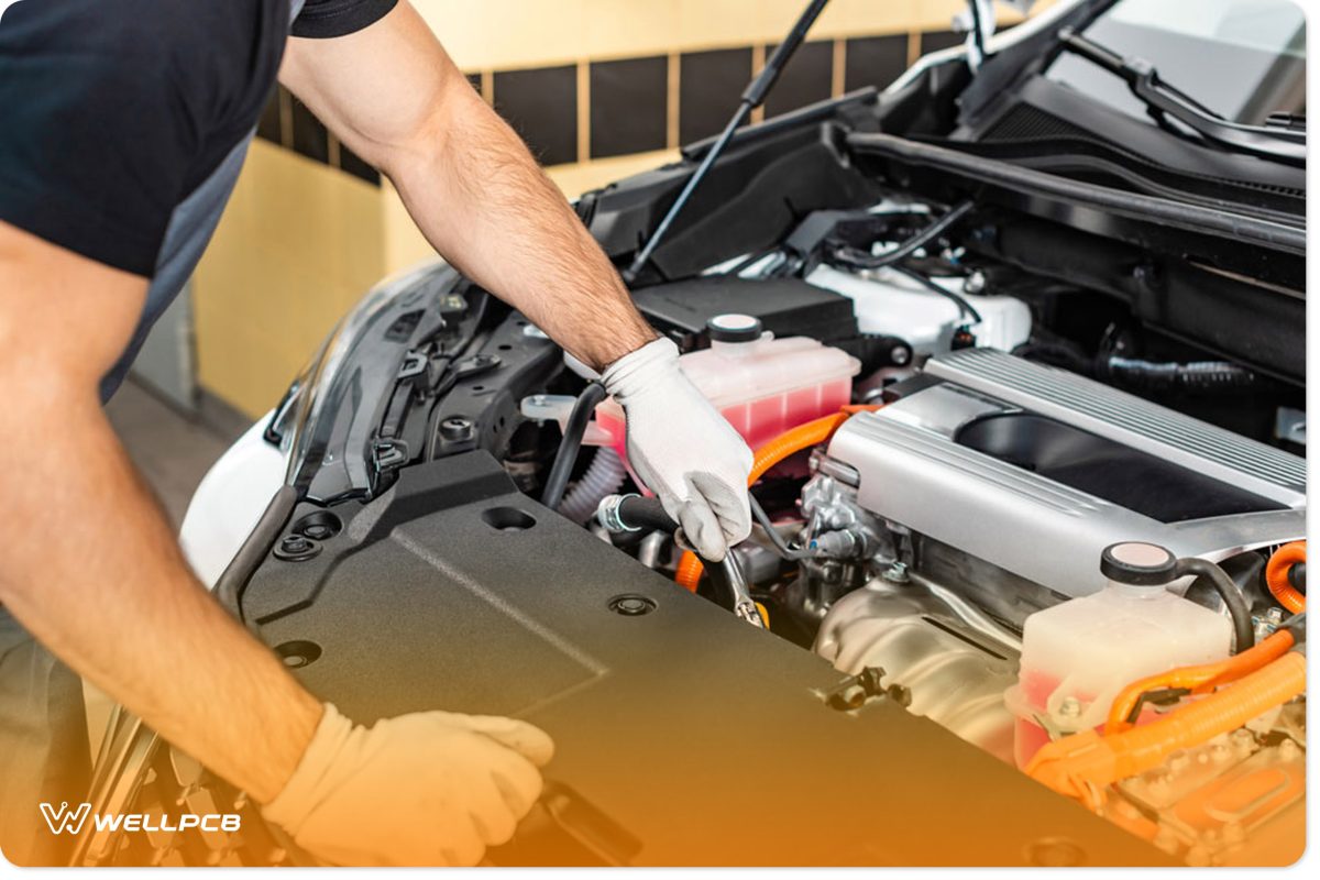 Partial view of mechanic inspecting car engine compartment