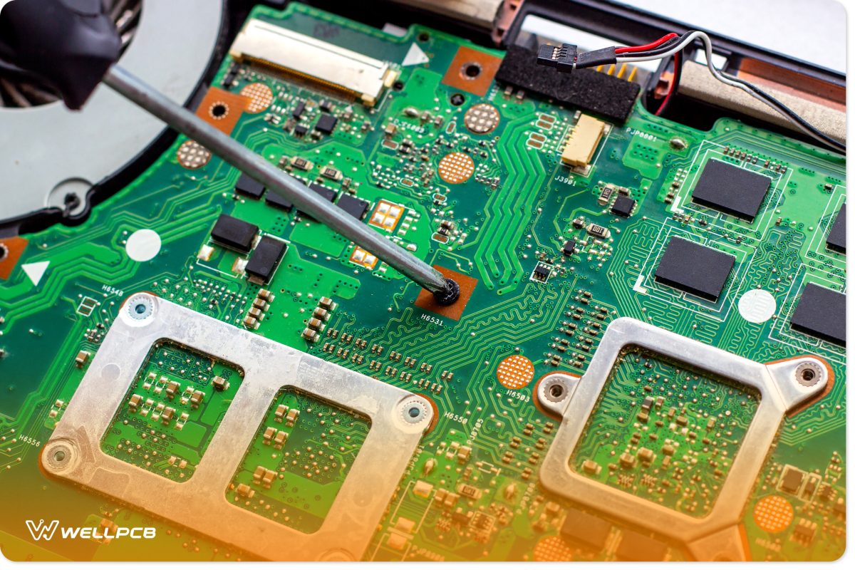 Technician repairing PCB layout with soldering iron