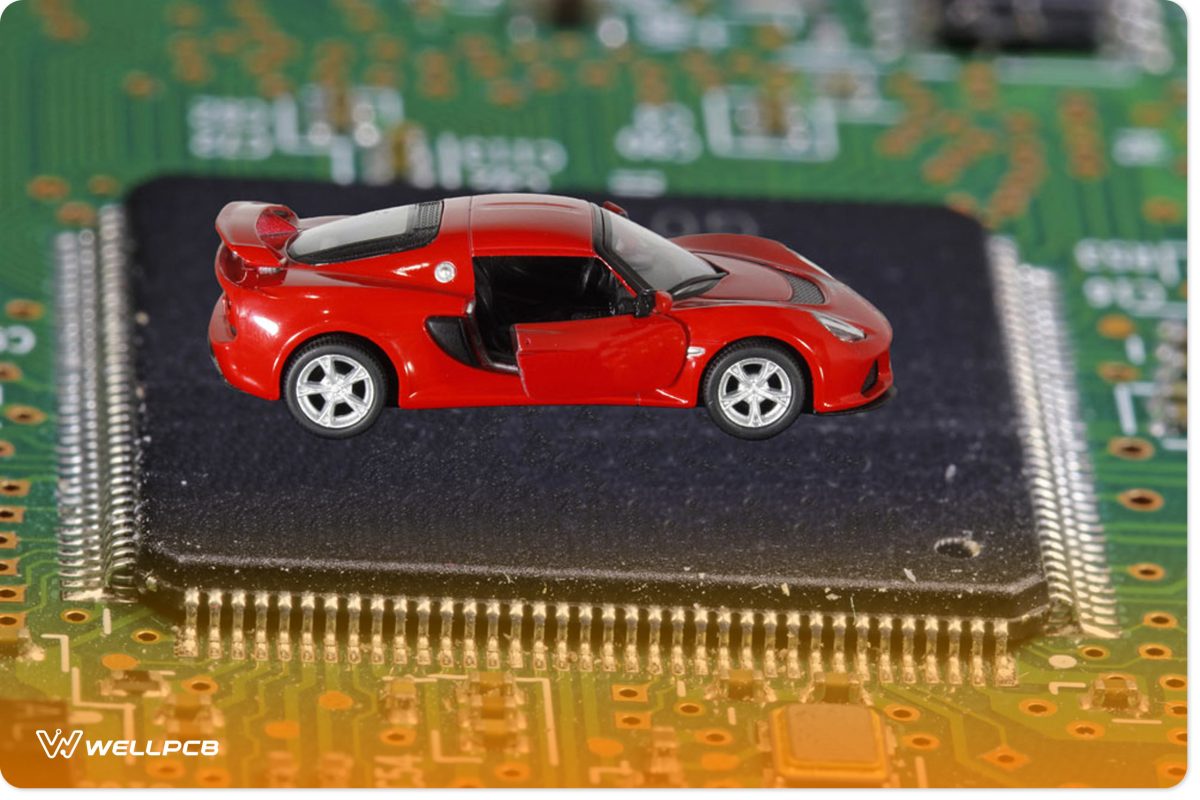 The red car stands on the microprocessor. The concept of a shortage of chips in the automotive industry